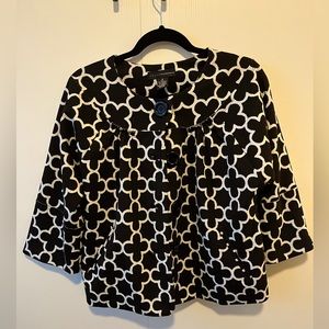 Women’s cropped jacket.  Wide sleeves and big black buttons